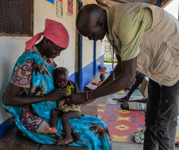 Achoc and her one year old daughter Atong receive care at an Action Against Hunger nutrition center.